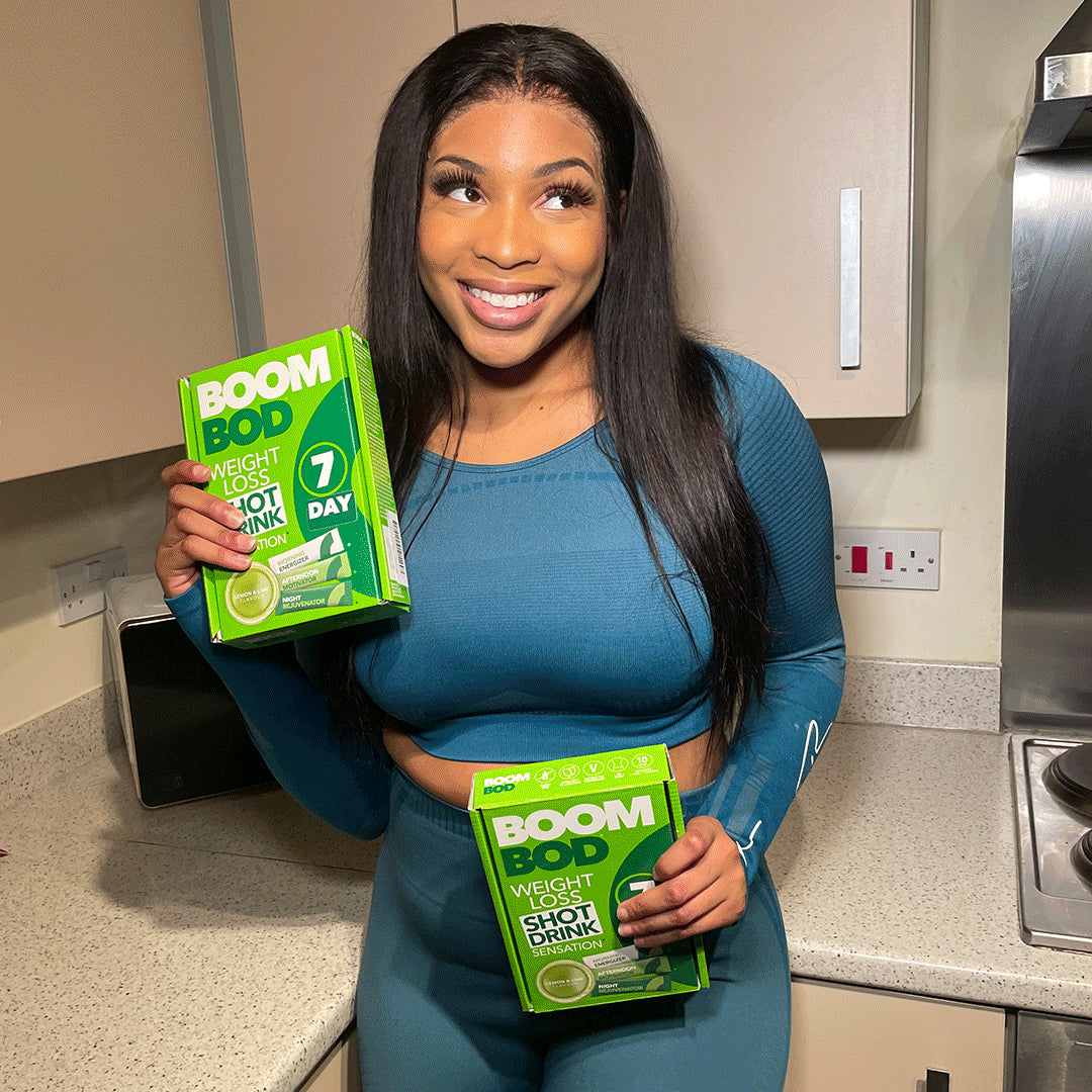 Woman Holding 2 Boombod Lemon Lime 7 Day Achievers