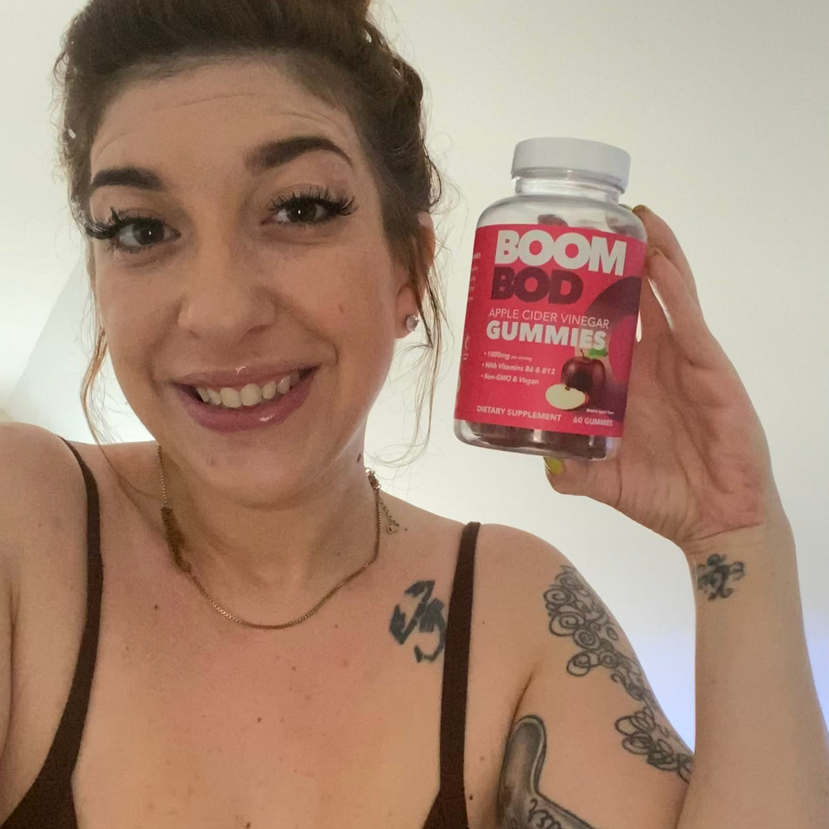 Boombod Customer Holding Apple Cider Vinegar Gummies